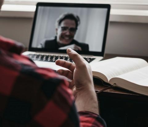 Laptop with video call and man chatting